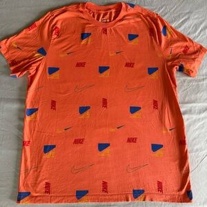 Nike Men's Vibrant Orange Tee with Blue and Yellow Retro Accents